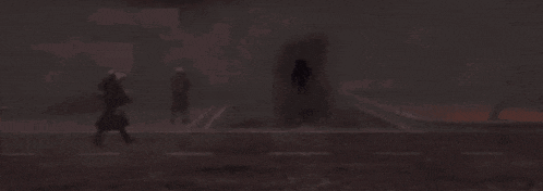 a man in a trench coat is walking through a foggy street