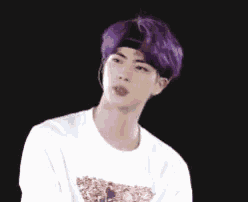 a young man with purple hair wearing a headband and a white shirt