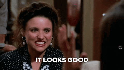 a woman is making a face and saying it looks good