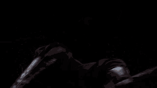 a close up of a person 's face in the dark .