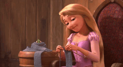 rapunzel is sitting in a chair knitting a scarf .