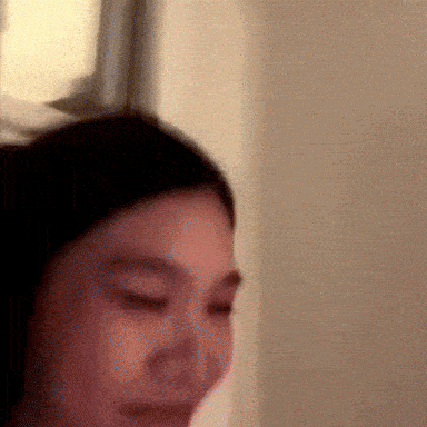 a close up of a woman 's face with a blurred background
