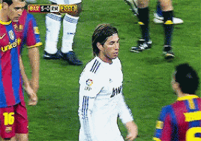 a soccer player in a white jersey with the number 10 on his shorts