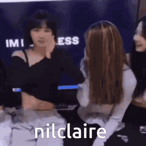 a group of girls are sitting next to each other and one of them says nilclaire