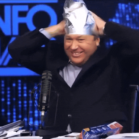 a man wearing a tin foil hat in front of a fox logo