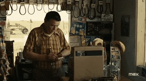 a man standing in front of a pay out machine