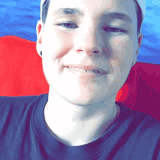 a close up of a person 's face with a red white and blue background