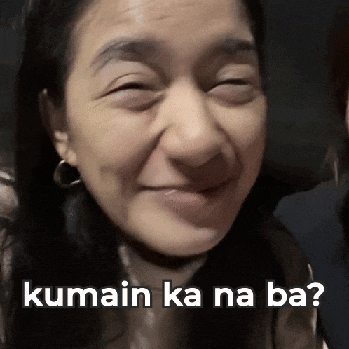 a close up of a woman 's face with kumain ka na ba written on the bottom