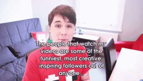 a man in a red shirt is talking about his videos