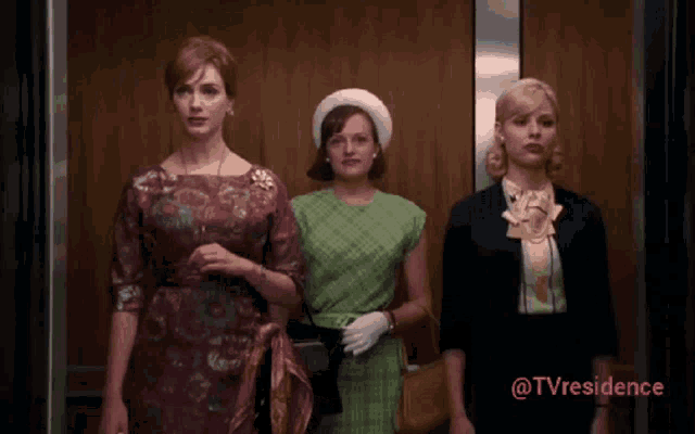 three women are standing in an elevator with the words @tvresidence above them