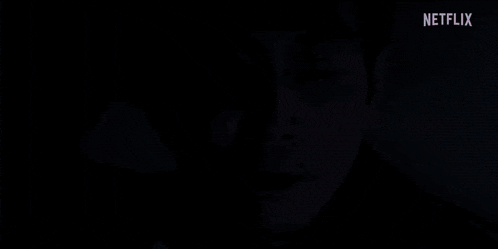 a man is laying in bed with his eyes closed and a netflix logo in the corner .