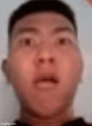 a close up of a man 's face with his mouth open .