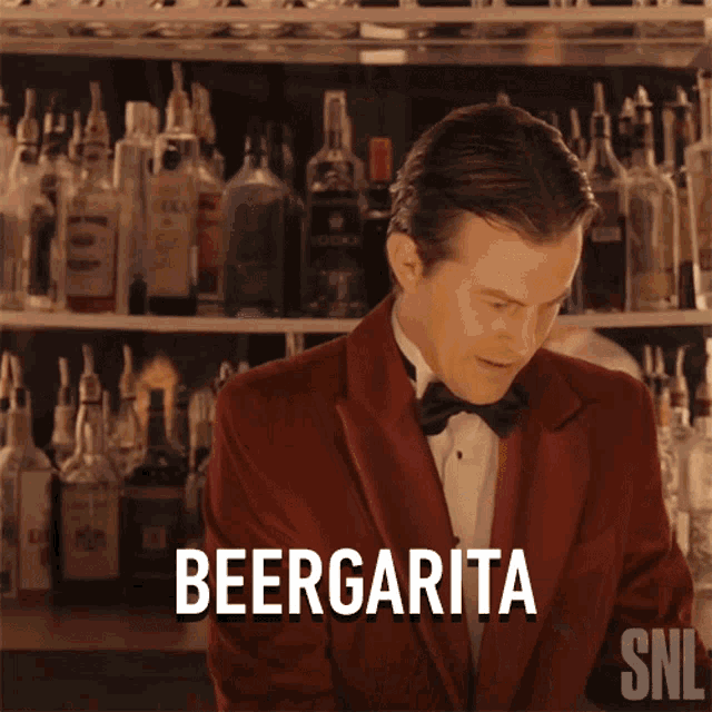 a man in a tuxedo and bow tie is making a beergarita