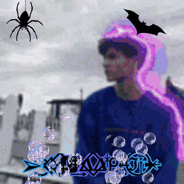 a man in a blue shirt is surrounded by bubbles and a spider and a bat