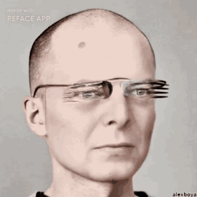 a bald man wearing sunglasses with a fork on his eye