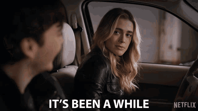 a woman sitting in a car with the words it 's been a while on the bottom