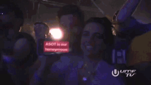 a man and woman are holding a cell phone that says asot is our honeymoon