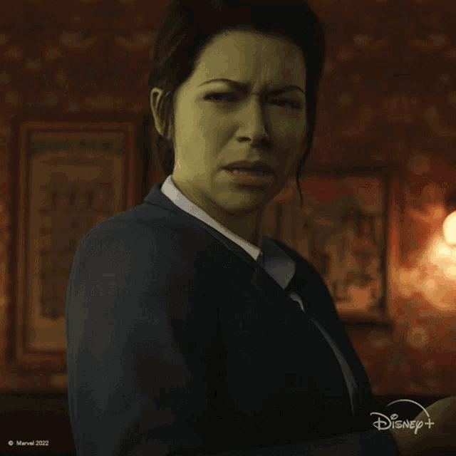 a woman with a disney logo on the bottom