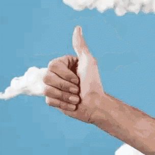 a hand is giving a thumbs up in front of a blue sky with clouds .