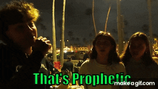 a group of people are standing in front of a sign that says that 's prophetic make a gif.com