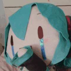 a stuffed animal with tears coming out of its eyes .