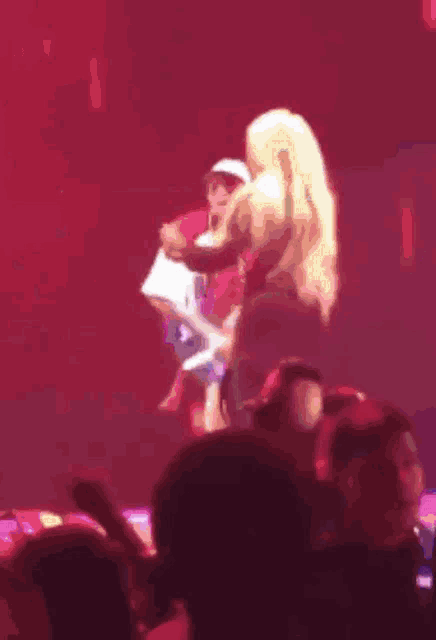a blurry picture of a man and a woman dancing on a stage