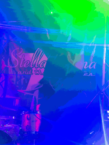 a drum set is in front of a sign that says stella and the tara