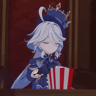 a girl with a crown on her head is holding a box of popcorn .
