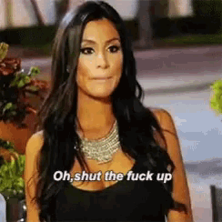 a woman says oh shut the fuck up while wearing a black dress