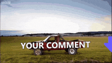 a red truck is parked in a grassy field with the words " your comment " on the bottom