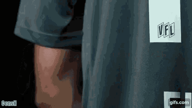 a close up of a person 's torso with a vfl logo on it