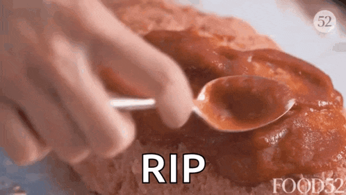 a person is putting ketchup on a meatloaf with a spoon and the word rip is next to it .