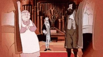 a man and a woman are standing in a hallway .