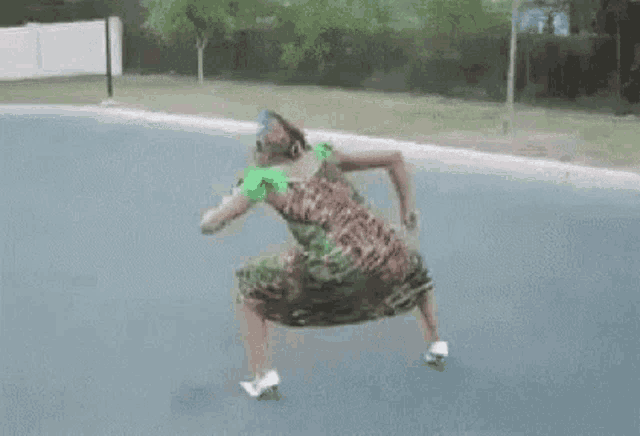 a woman in a leopard print dress is dancing on a street .