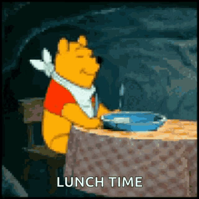 winnie the pooh is sitting at a table with a plate of food and the words lunch time written below him