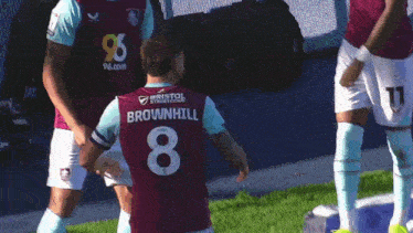 a soccer player with the number 8 on his back