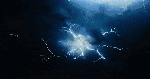 a lightning bolt strikes a cloud in the sky