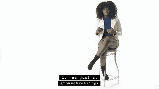 a woman sitting on a stool with the words " it was just so groundbreaking " written below her