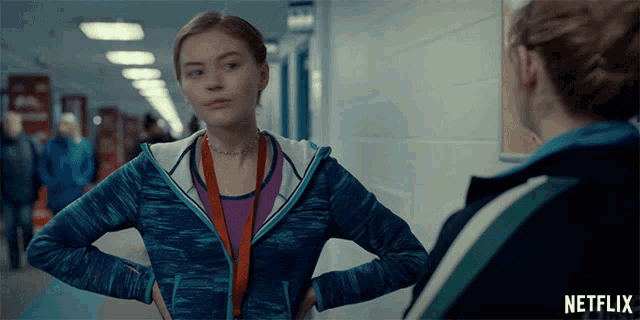 a netflix ad shows a girl standing in a hallway