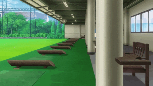 a row of wooden benches are lined up on a green carpeted floor