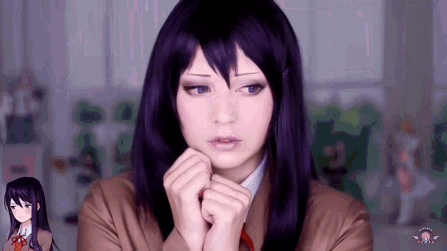 a woman in a purple wig is making a face with her hands