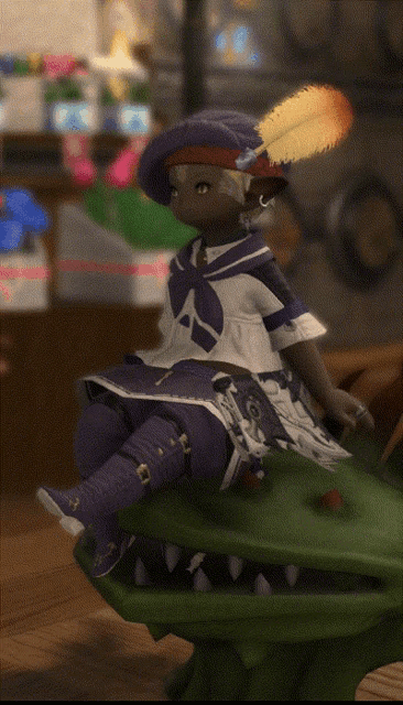 a little girl in a sailor outfit is sitting on a green monster