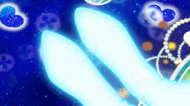 a rabbit 's ears are glowing in the dark with a blue background