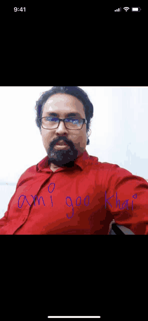 a man with glasses and a beard is wearing a red shirt that says why goo khai