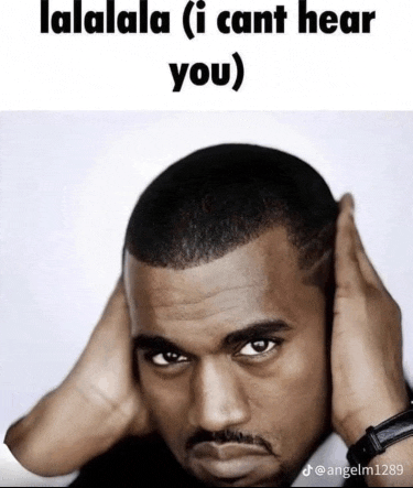 a man is covering his ears with his hands and a caption that says lalala ( i cant hear you )