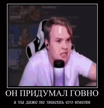 a man is sitting in a chair with headphones on and a microphone in his hand .