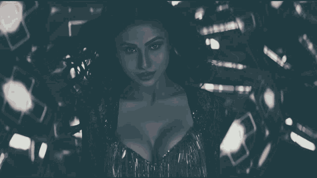 a black and white photo of a woman with a large breast