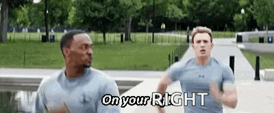 two men are running down a sidewalk in a park with the words `` on your right '' written on the bottom .