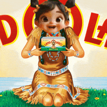 a little girl in a native american outfit holds a box of land lakes butter