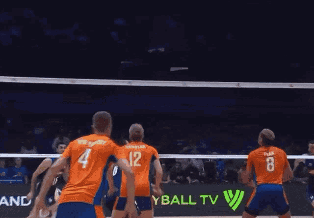 a volleyball game is being played in front of a sign that says command only on